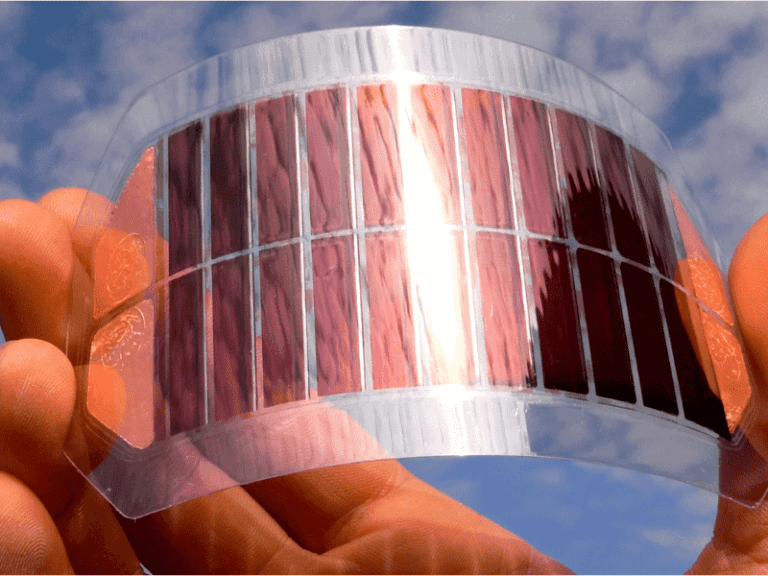 Flexible solar panel held in a hand