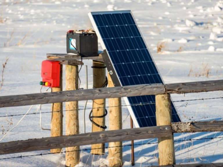 Solar panel being charged Snow covered ground