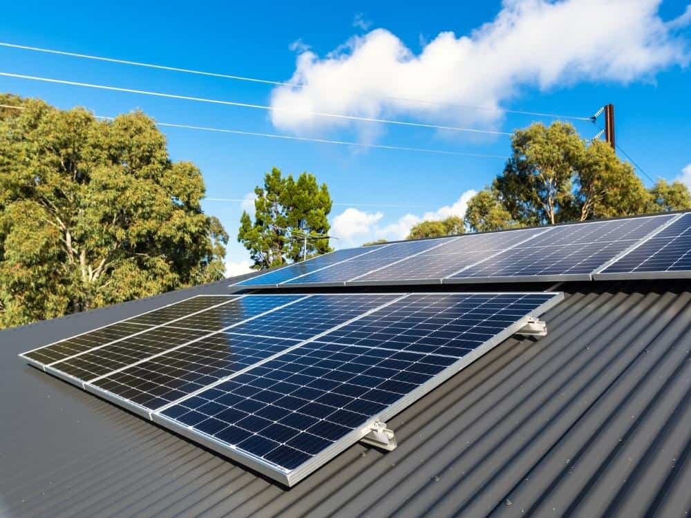 Solar panels on a house with a metal roof