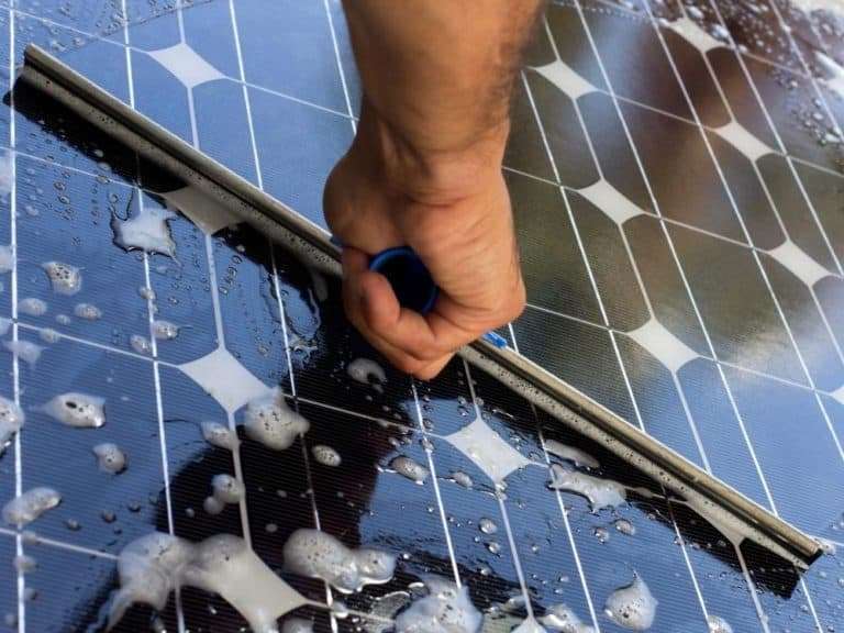 Water on solar panels being washed